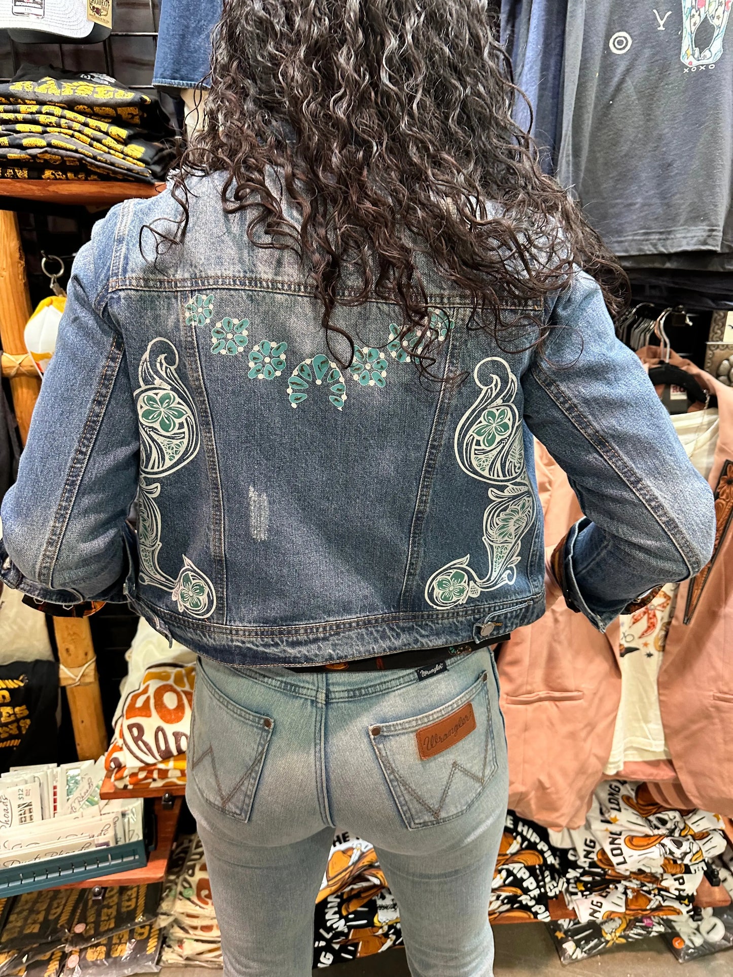 Denim jacket with Squash Blossom and tooled sides. The Rodeo Rose